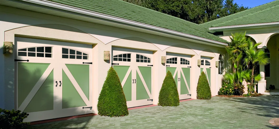 Amarr by Design Lowry custom painted wood garage door installed on a craftsman home