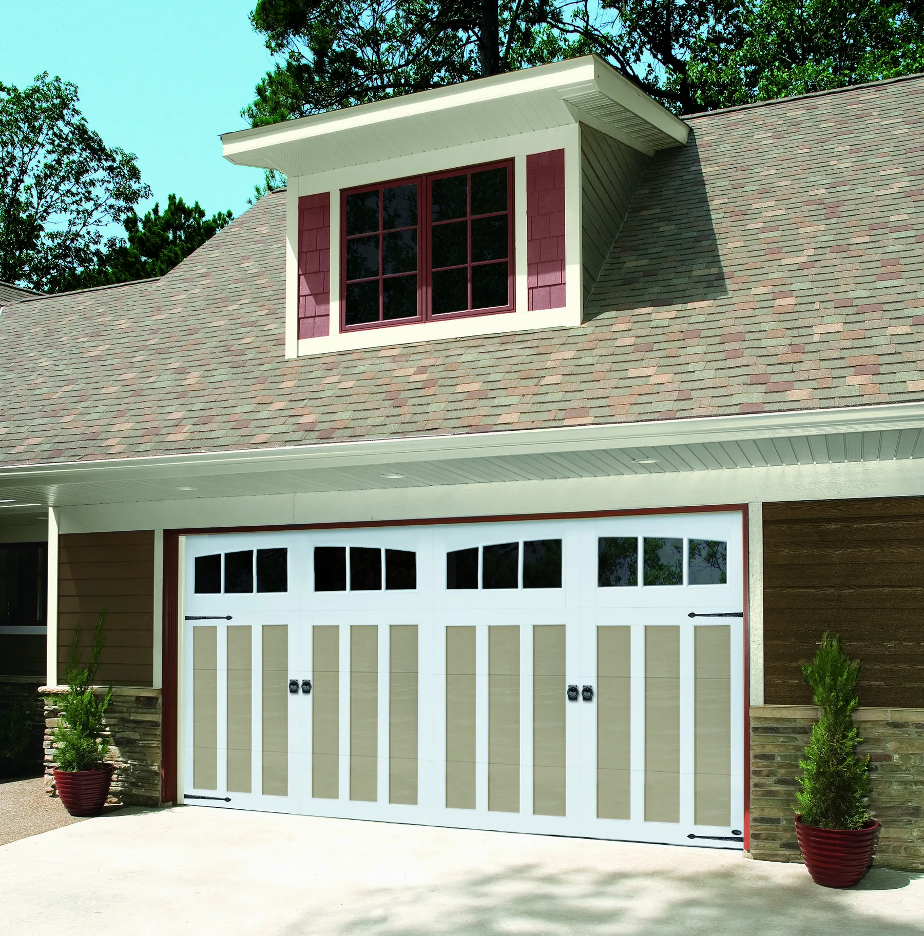 Amarr Carriage Court carriage house garage door in tan with white trim
