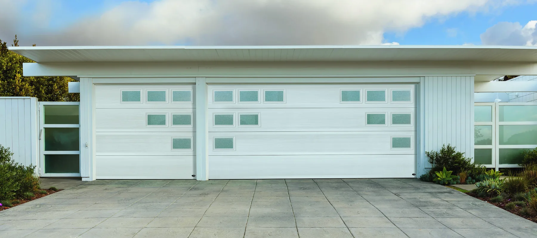 Amarr flush panel garage door in true white with decorative mosaic window inserts