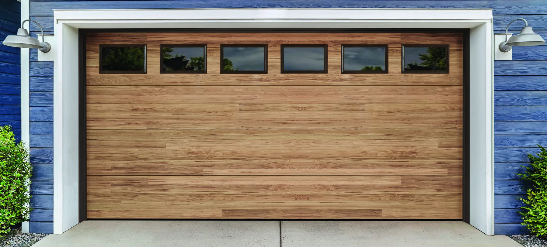 Amarr Northwoods modern plank garage door in dune