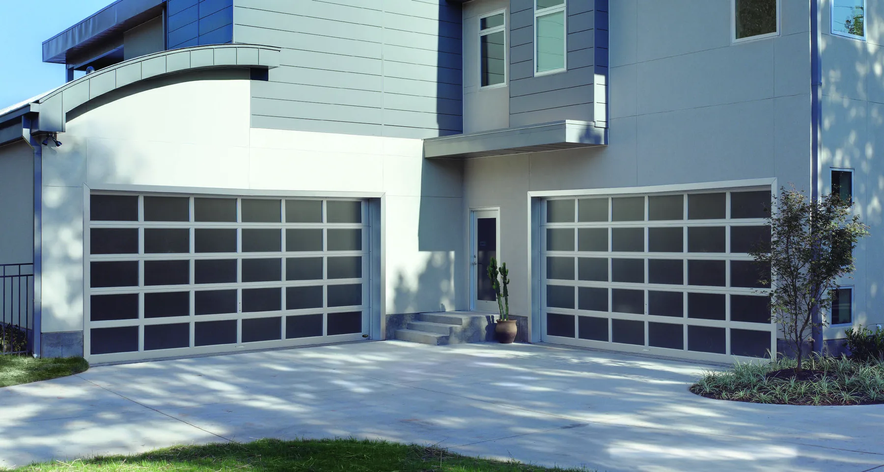Amarr Vista aluminum garage door in clear anodize with obscure glass