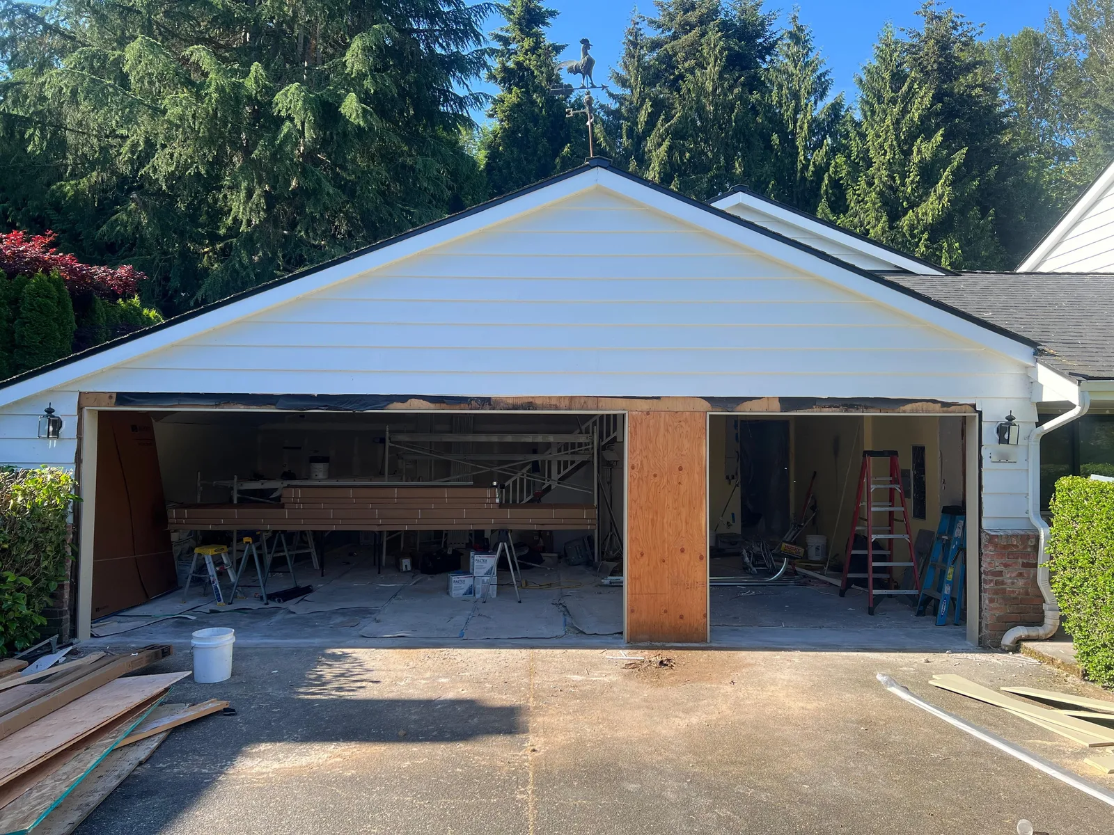 Open garage with no doors during installation at a Bellevue home